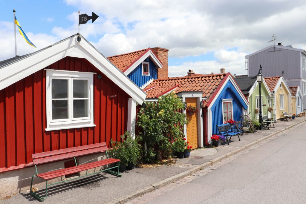 A row of colorful houses sitting next to each other